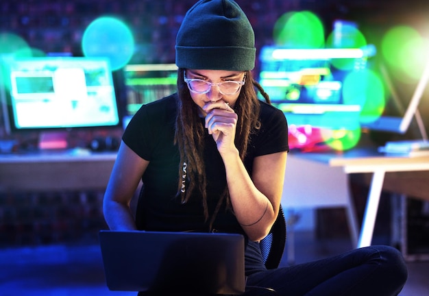 laptop woman and hacker thinking in home for programming software or cybersecurity neon computer and female coder or programmer reading information for hacking idea while on dark web at night