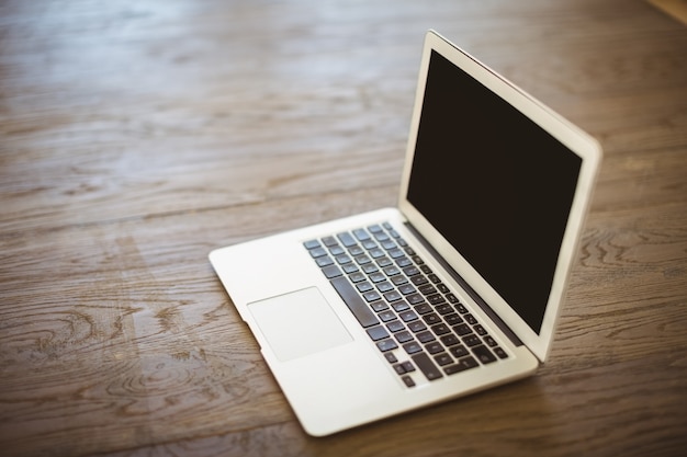 Photo laptop on wooden floor