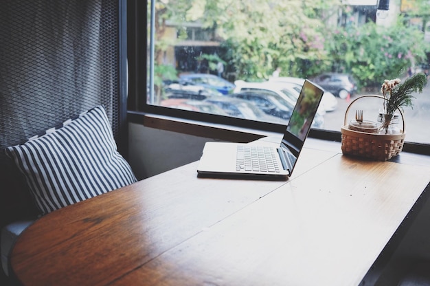 laptop on wooden table