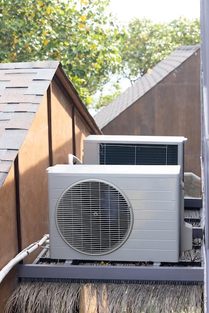 A large air conditioner is on a roof of a building