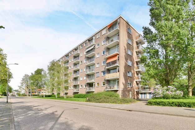 A large apartment building on the side of a street