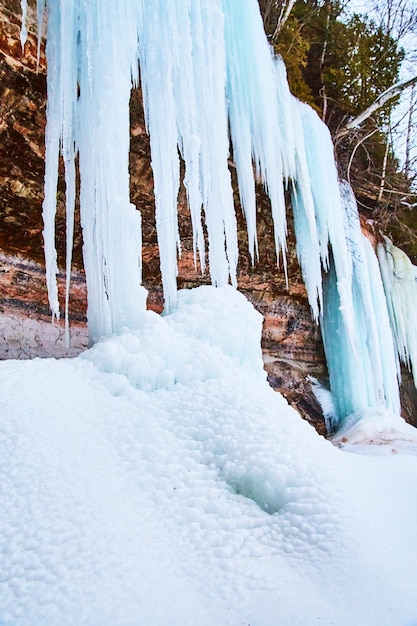 Large blue ice formations on cliffs