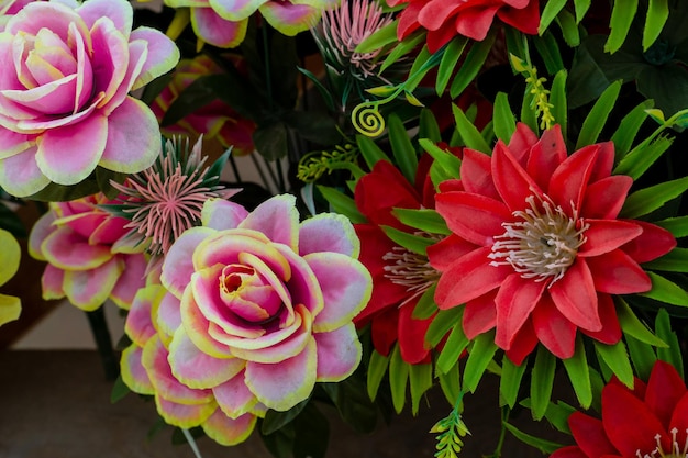 A large bouquet of colorful flowers for the holiday Interior decoration with artificial flowers The work of a florist at a banquet wake holiday or wedding