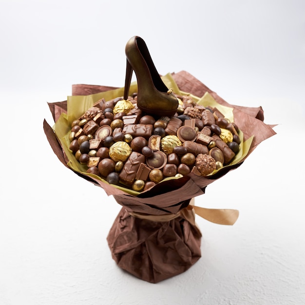 Large bouquet of different chocolates and a chocolate shoe as a gift