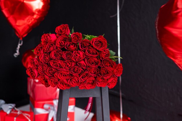 large bouquet of red roses on a dark background Valentines Day Greeting Card