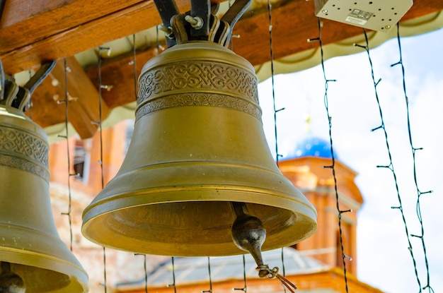 A large brass bell in the church.