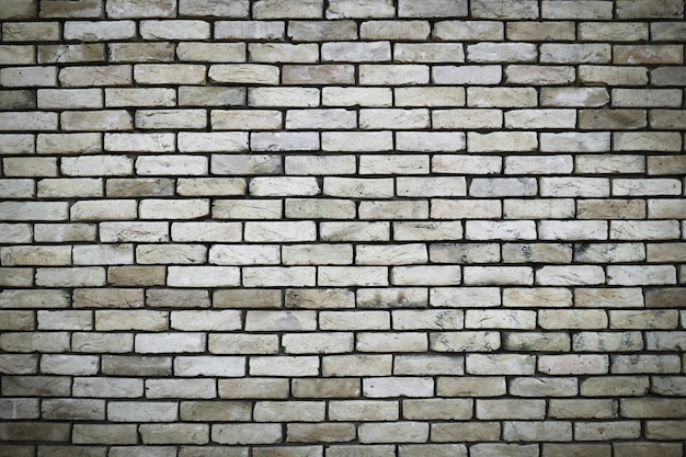 Photo large brick wall, beige or khaki stone texture.