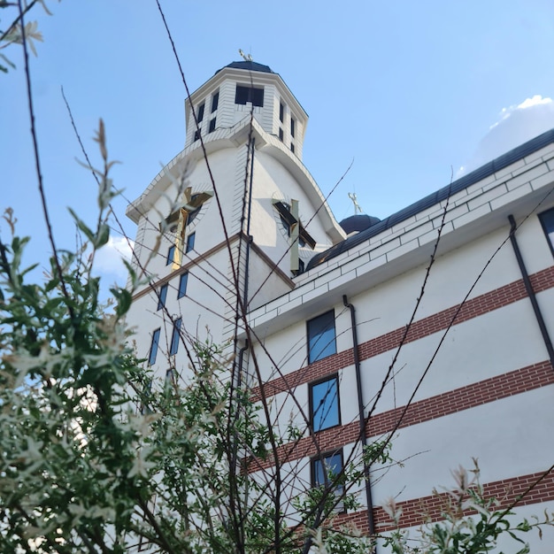 A large building with a clock tower on the front.