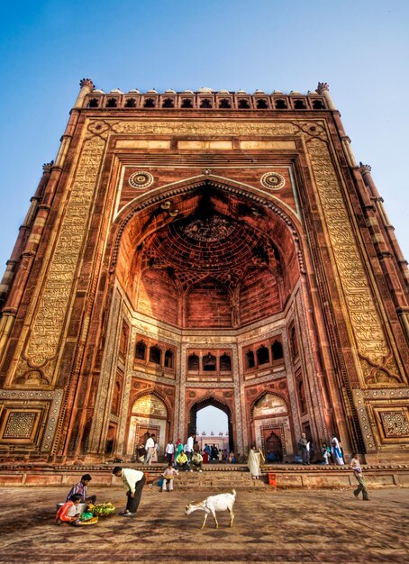 a large building with a large archway that says  the word  on the bottom