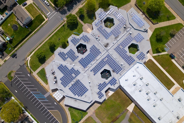 A large building with a large solar panel on the roof