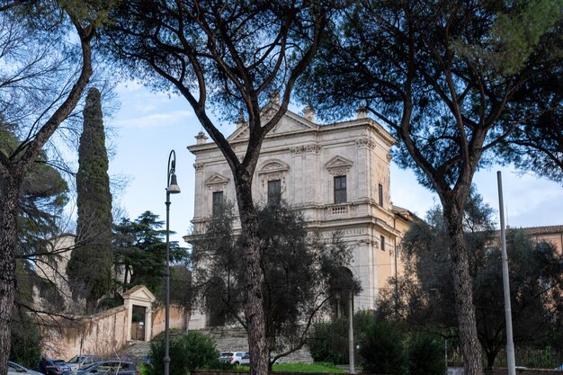 A large building with a lot of trees in front of it