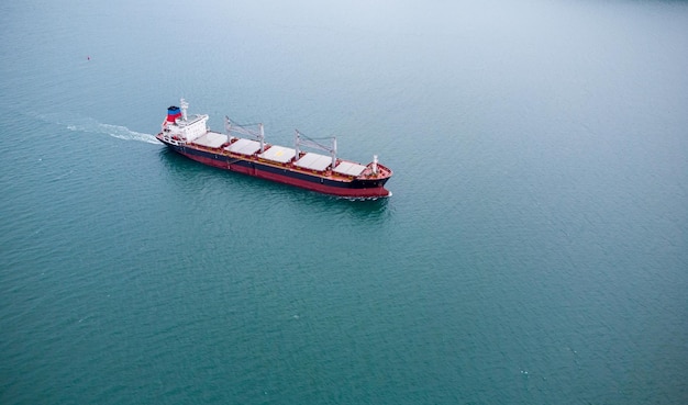 A large bulk carrier transports grain at sea aerial view