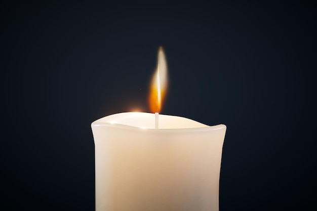 A large burning candle on a black background 3D render