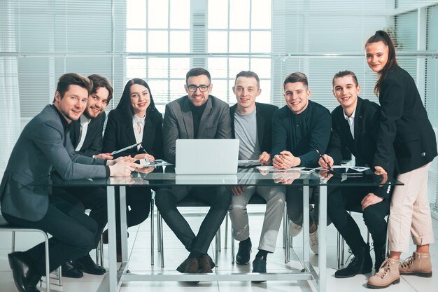 Large business team sitting at an office desk