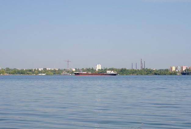 A large cargo ship sailing on the river