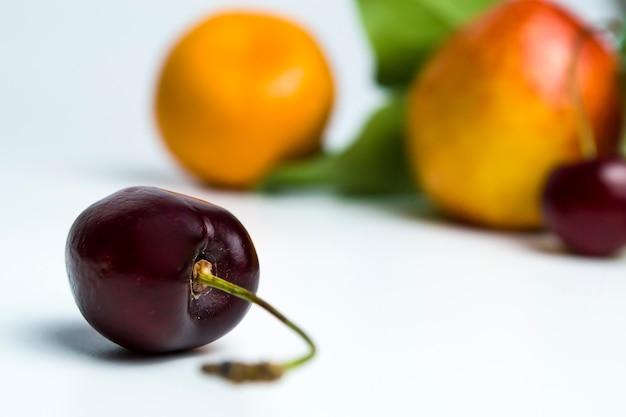 A large cherry on a white background