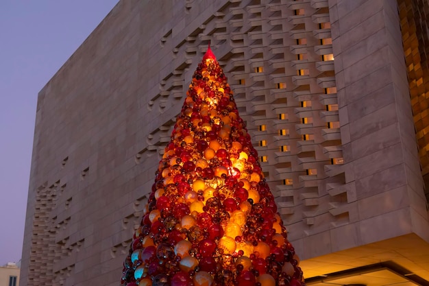 Large christmas tree made of glass balls made by maltese glassblowers to decorate capital of malta