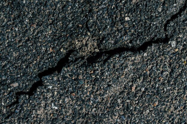 Large crack on the pavement close up