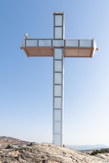 Large cross on top of the peñon de san cristobal on the coast of granada