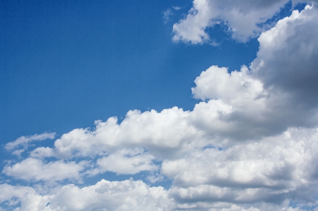 Large cumulus clouds in a blue sky