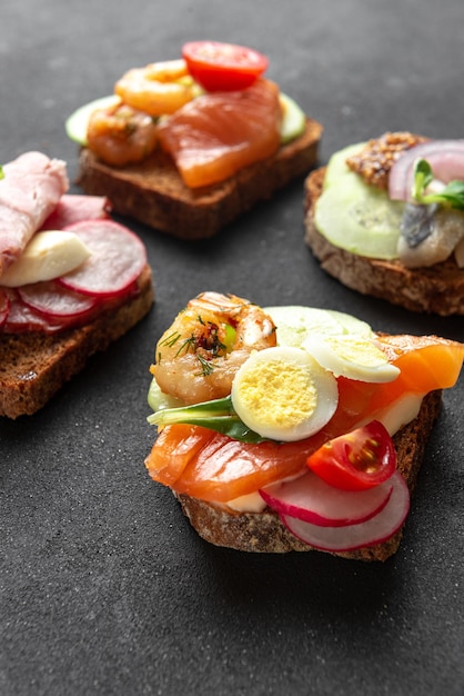 Large danish sandwich on a dark background