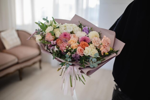 Large delicate bouquet on a white background with dahlias roses hydrangea