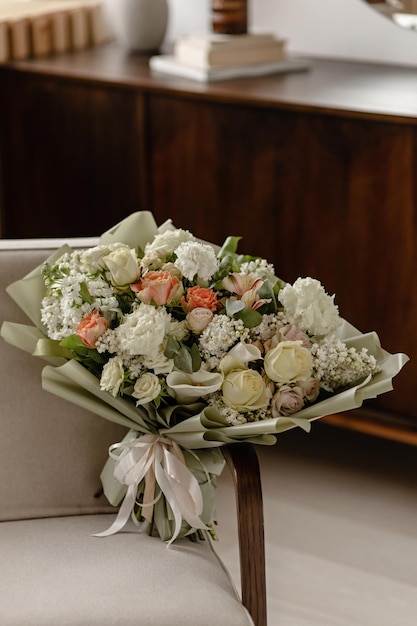 Large delicate spring bouquet of flowers in the interior Interior with flowers mirror chest of