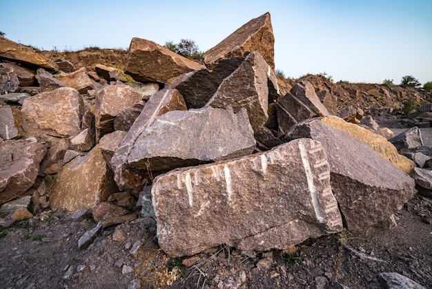 Photo large deposits of stone materials near a mining quarry