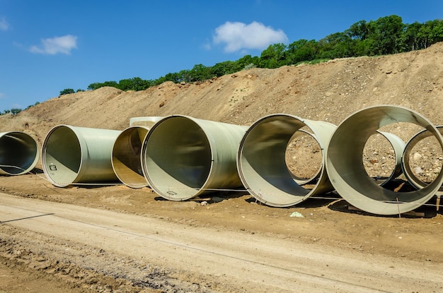 Large diameter pipes on the ground.