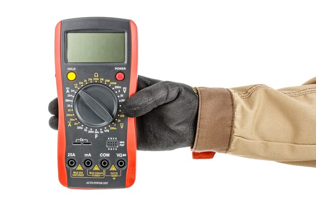 Large digital multimeter with turned off display in electrician hand in black protective glove on white