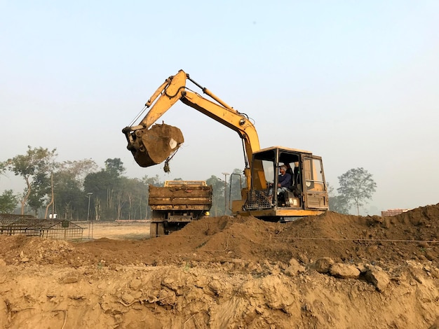 A large excavator is being used to dig dirt.