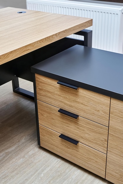 Large executive desk made of oak timber veneer with dark grey enamel in trendy minimal style