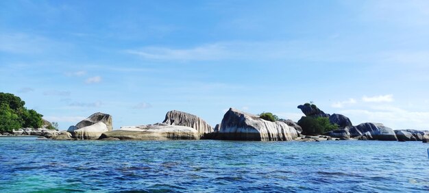 A large expanse of granite boulders off the coast