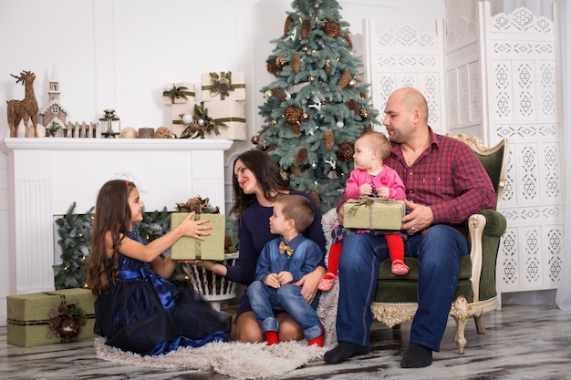 A large family got together to celebrate Christmas. Warm family holiday with loved ones.