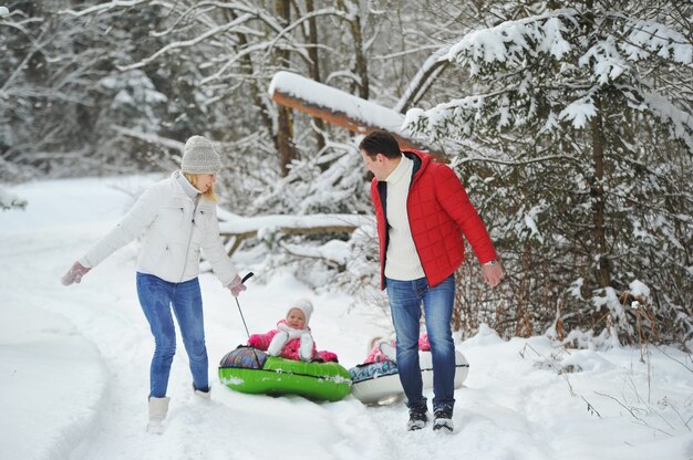 A large family with children on a walk in winter.