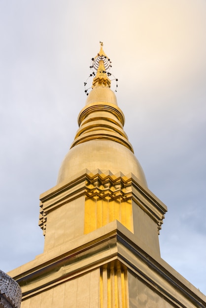 Large golden temple with sky background, Name is Srivang Chai Pagoda, Located in Lamphun, 