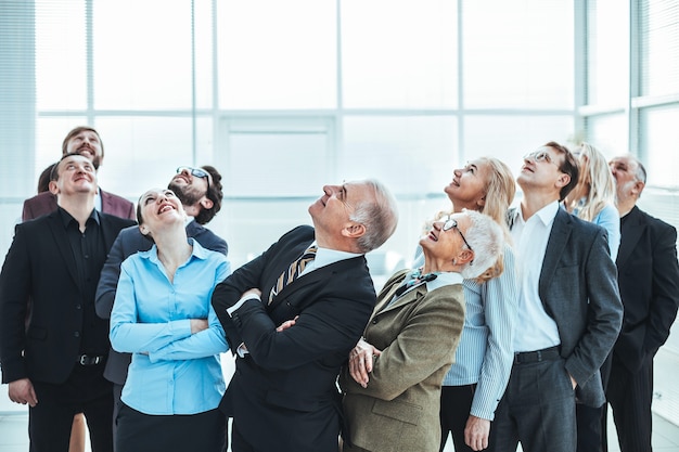 Large group of diverse business people looking up. photo with copy-space