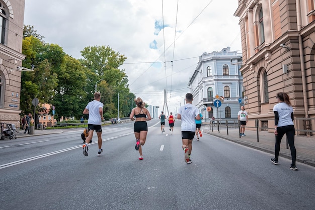 Large group man runners running marathon