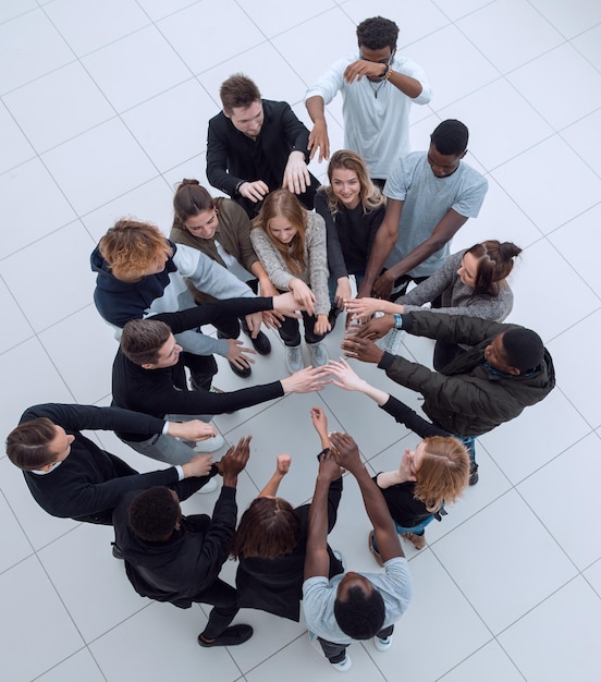 Large group of people seen from above gathered in the shape
of