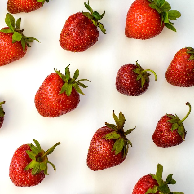 Large group of strawberries isolated on white background Lots of red berries