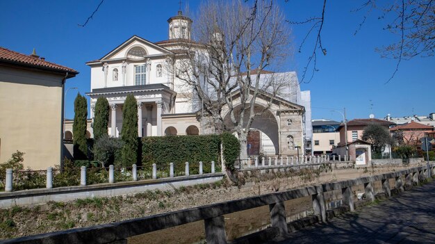 A large house with a bridge in the background