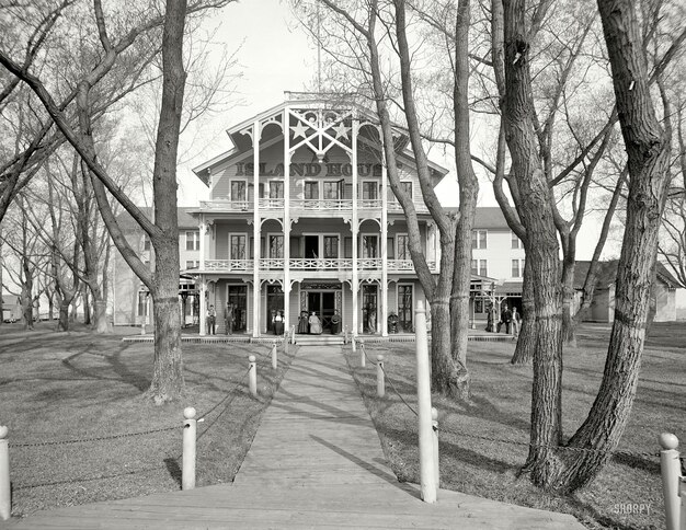 a large house with a porch on the front and a large porch on the front