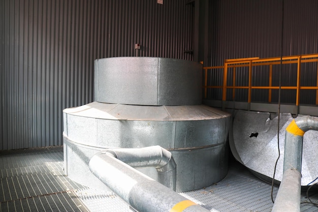 Large iron heat exchanger tank reactor distillation column in thermal insulation of fiberglass