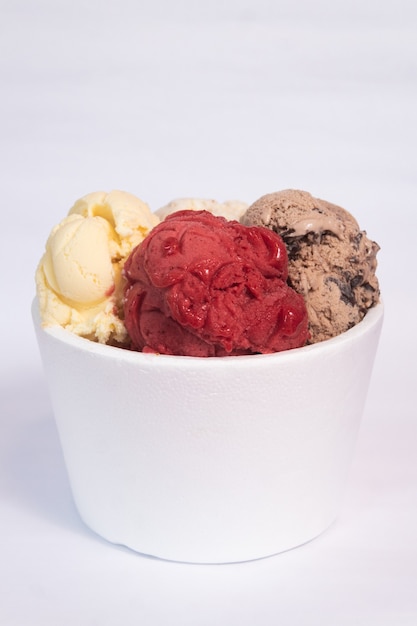 A large isopor container with ice cream of different flavors