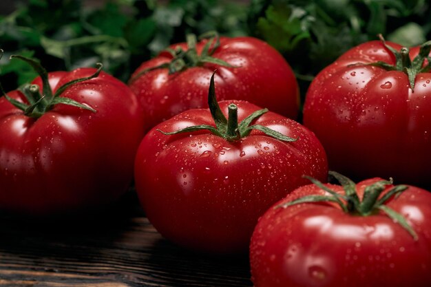 Large juicy tomatoes on a wooden board