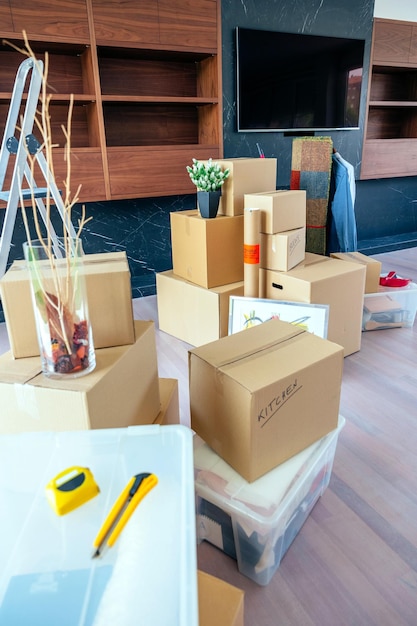 Large living room with stack of moving boxes