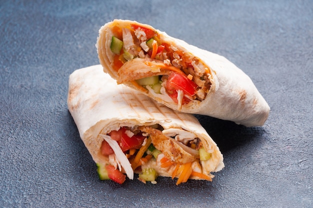 Large meat Shawarma in wheat pita bread with chicken fillet