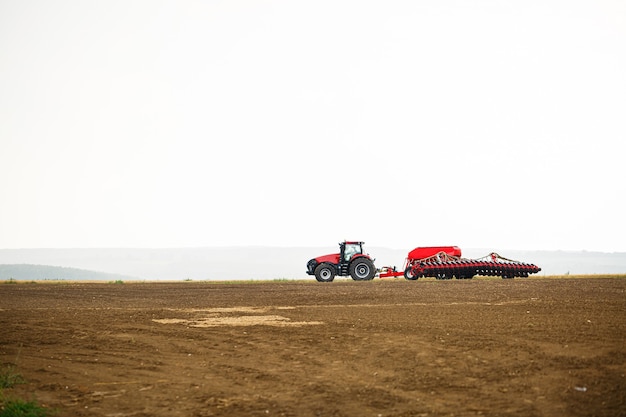 Large modern tractor for preparing the field after winter for sowing grain