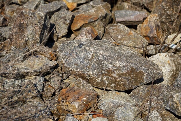 Large natural stones piled up in the bright sun