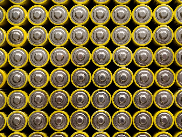 A large number of old yellow AA batteries.